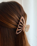 PINCE À CHEVEUX ROSE